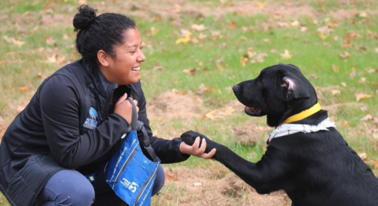 Hartwick College student with Guiding Eyes Puppy